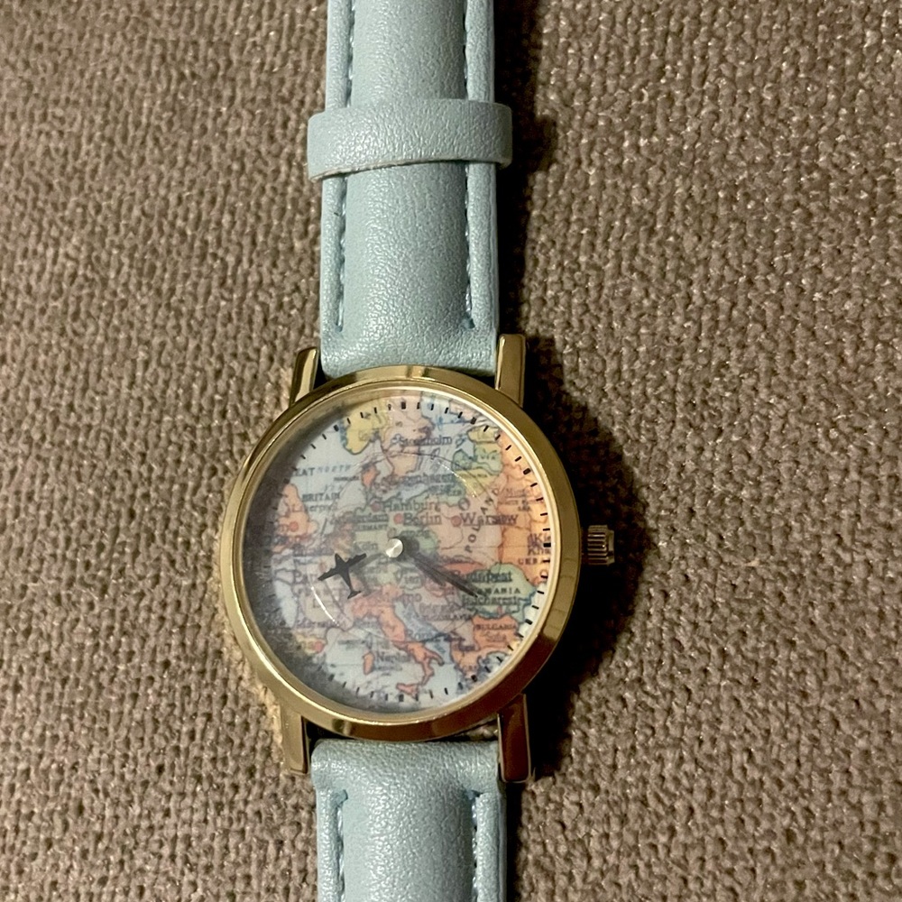 BRAND NEW blue women’s watch. Featuring map design.
